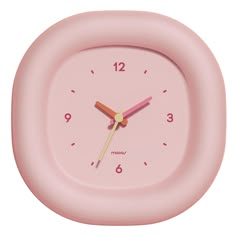 a pink clock with numbers on the face