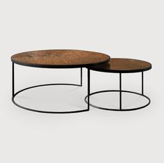 two tables with metal bases and wood tops, one is black and the other is brown