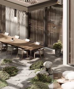 an outdoor dining area with wooden table and chairs