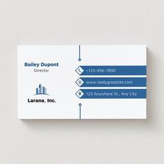 a business card with an image of a building on the front and blue lines in the back