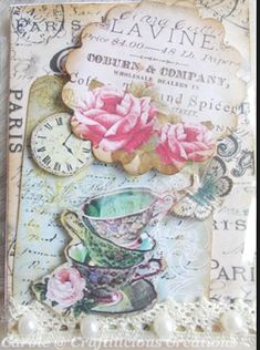 a card with pink roses in a teacup