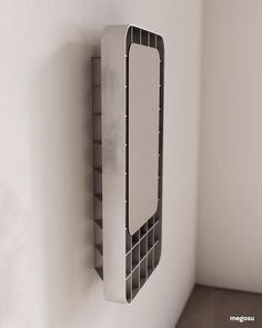 a mirror mounted to the side of a wall