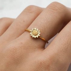 Bring Sunshine To Your Life Everyday! Add This Exquisite Floral Ring To Whatever You Are Wearing. It Features A Beautiful Sunflower Plated In 18k Gold. Simple And Elegant. Sunflowers Symbolize Happiness, Optimism, Honesty, Longevity, Peace, Admiration, And Devotion. The Sunflower Possibly Surpasses All Others In Terms Of Its Universal Power To Bring Joy To People. With A Round Face And Bright Yellow Petals Resembling Rays Of Sunshine, The Sunflower Has Important Cultural And Spiritual Significan Yellow Flower Ring For Anniversary, Yellow Flower Ring For Wedding, Sunflower Design Rings As Gifts, Gold Flower Rings For Spring, Gold Floral Rings For Spring, Spring Flower-shaped Gold Rings, Anniversary Flower Ring With Sunflower Design, Anniversary Sunflower Design Flower Ring, Sunflower Design Flower Ring For Gift