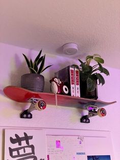 a skateboard mounted to the side of a wall above a shelf with books and plants