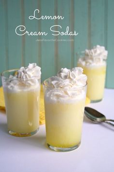 lemon cream sodas in small glasses with whipped cream on top