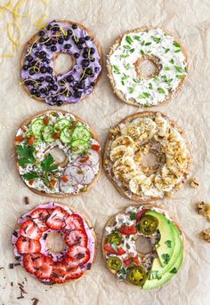 six doughnuts with different toppings on them are arranged in the shape of donuts