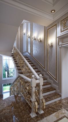 an elegant staircase with marble floors and walls