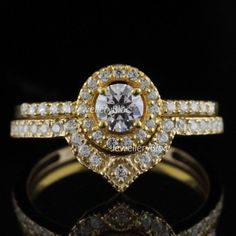 a diamond ring with two rows of diamonds on top and the middle, set in yellow gold