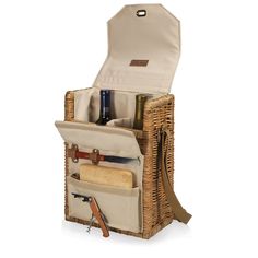 an open wicker bag with wine bottles and other items in it