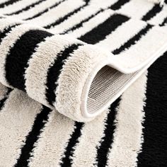 a black and white rug with stripes on it