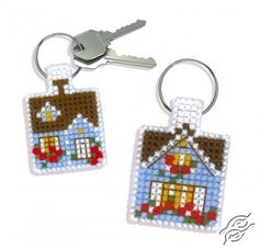 two key chains with houses on them