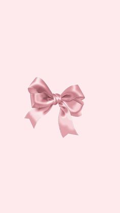 a pink background with a large bow on it