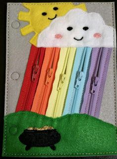 this is an applique made to look like the sun, clouds and rainbows