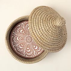 two woven baskets sitting on top of each other