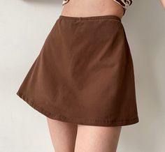 Classic retro style brown skirt. We love this piece paired with our Leopard Baby Halter Tank. Details: 95% Cotton / 5% Spandex Cold Hand Wash / Cool Iron Built-in Safety Shorts Handmade pieces will take 2-4 weeks to dispatch Size / Fit: Model wears a Small Model Info: Chest 82 cm Waist 65 cm Hips 88 cm Height 165 cm SIZE CHART Hips Waist Length Small 86 cm 60 cm 37 cm Medium 90 cm 64 cm 38 cm Large 94 cm 68 cm 39 cm XL 98 cm 72 cm 40 cm Safety Shorts, Leopard Baby, Baby Leopard, Bodycon Dresses Casual, Brown Skirt, Halter Tank, Brown Skirts, Brown Pants, Crop Top Blouse