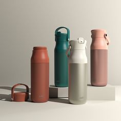 thermos bottles are lined up on top of each other, and one is empty