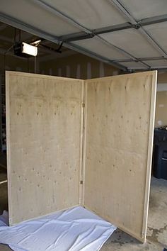 an open wooden box sitting inside of a garage