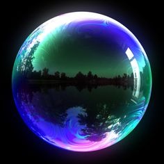 an image of a large bubble in the air with trees and sky reflected in it