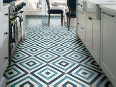 a kitchen with blue and white tile flooring