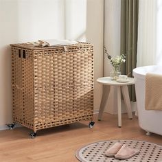 a wicker cabinet next to a bathtub in a room with wood flooring