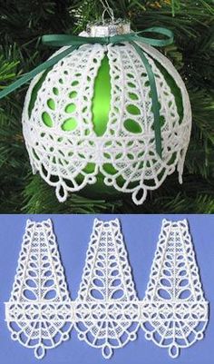 an ornament hanging from a christmas tree with green ribbon and white crochet