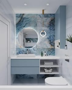 a bathroom with blue and white marble on the walls, toilet, sink and mirror