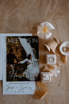 the wedding photo is next to some flowers and candles