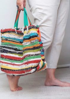 "A cheerful multicoloured bag that evokes the hippy style, made from a jarapa or small carpet of recycled fabrics. The bag is created one by one, without cuts, it is sewn by hand and no waste is produced in its creation.  It is a large bag with two handles, lined and with an inside pocket that can hold a laptop or shopping, bohemian style and versatile use. A great gift for your loved one. Visit this unique and sustainable bag shop. https://www.etsy.com/es/shop/DesignUpcycling CARACTERISTICS:  M Bohemian Style Bag, Recycle Tote Bag, Upcycling Design, Bohemian Bag, Recycled Textiles, Estilo Hippy, Sustainable Bag, Hippy Style, Textile Waste