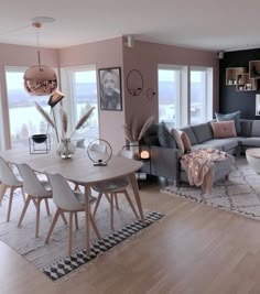 a living room filled with furniture and lots of windows