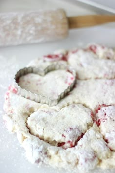 heart shaped cookies sitting on top of a white counter