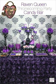 a table topped with lots of purple candy bar decorations and desserts on top of it