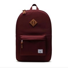 Details The Heritage Was Developed Using The Herschel Supply Co. Signature Look And Feel. Features An Ecofriendly Reinforced Bottom And Detailing. 100% Polyester One Exterior Zip Pocket With Key Clip 15'' Internal Media Pocket 19''H X 12''W X 5''D Two Padded Adjustable Shoulder Straps Imported Classic Red Backpack For Daily Use, Casual Burgundy Backpack For Everyday Use, Classic Red Backpack, Casual Burgundy Backpack For Everyday, Classic Red Standard Backpack, Burgundy Standard Backpack For School, Burgundy Standard School Backpack, Burgundy Backpack With Adjustable Strap For School, Everyday Burgundy Backpack