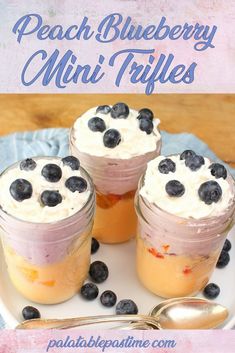 three small jars filled with blueberries on top of a white plate