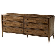 a large wooden dresser with drawers on it