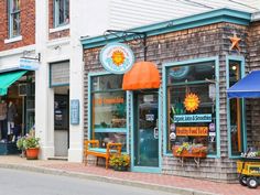 an outside view of a flower shop on the street