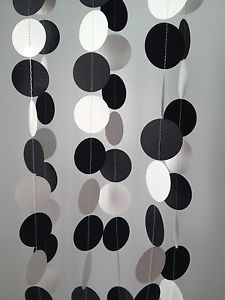 black and white paper circles hanging from strings