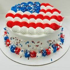 an american flag cake with red, white and blue icing