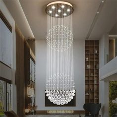 a large chandelier hanging from the ceiling in a living room