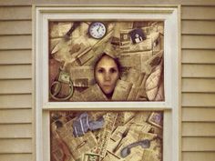 a woman looking out the window with clocks and other things on it's windowsill