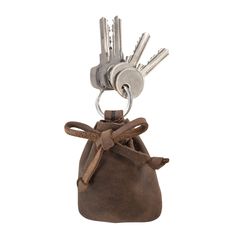 a brown leather bag with keys in it and a key chain hanging from the front