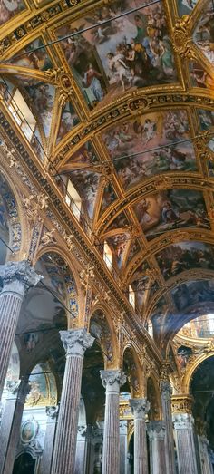 an ornate ceiling with many paintings on it