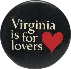 a black button with the words virginia is for lovers on it and a red heart