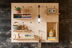 a wooden shelf with shelves and various items on it