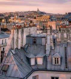 the roofs of old buildings in paris at sunset