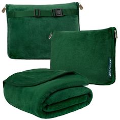 two green towels are folded up on top of each other and one has a belt around it