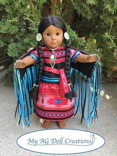 a doll dressed in native american clothing