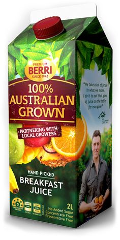 a carton of australian grown juice with oranges and green leaves on the side