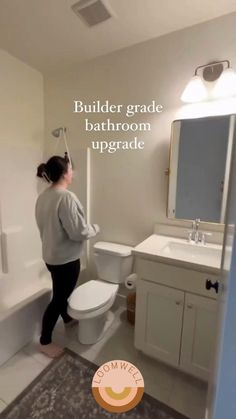 Video of a bathroom with new peel and stick wallpaper. Wallpaper Over Tile Bathroom, Small 1/2 Bath Ideas, Wallpaper For Bathroom Small Spaces, Small 1/2 Bath, Bathroom Wall Design, Peel And Stick Wallpaper Bathroom, Beige Tile Bathroom, Removable Wallpaper Ideas, Cozy Bathroom Ideas