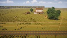 an aerial view of a farm with a house in the middle and trees around it