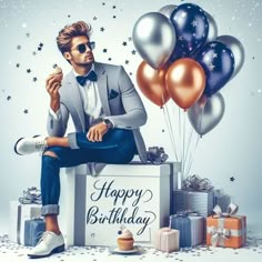 a man sitting on top of a box surrounded by presents and balloons with the caption happy birthday